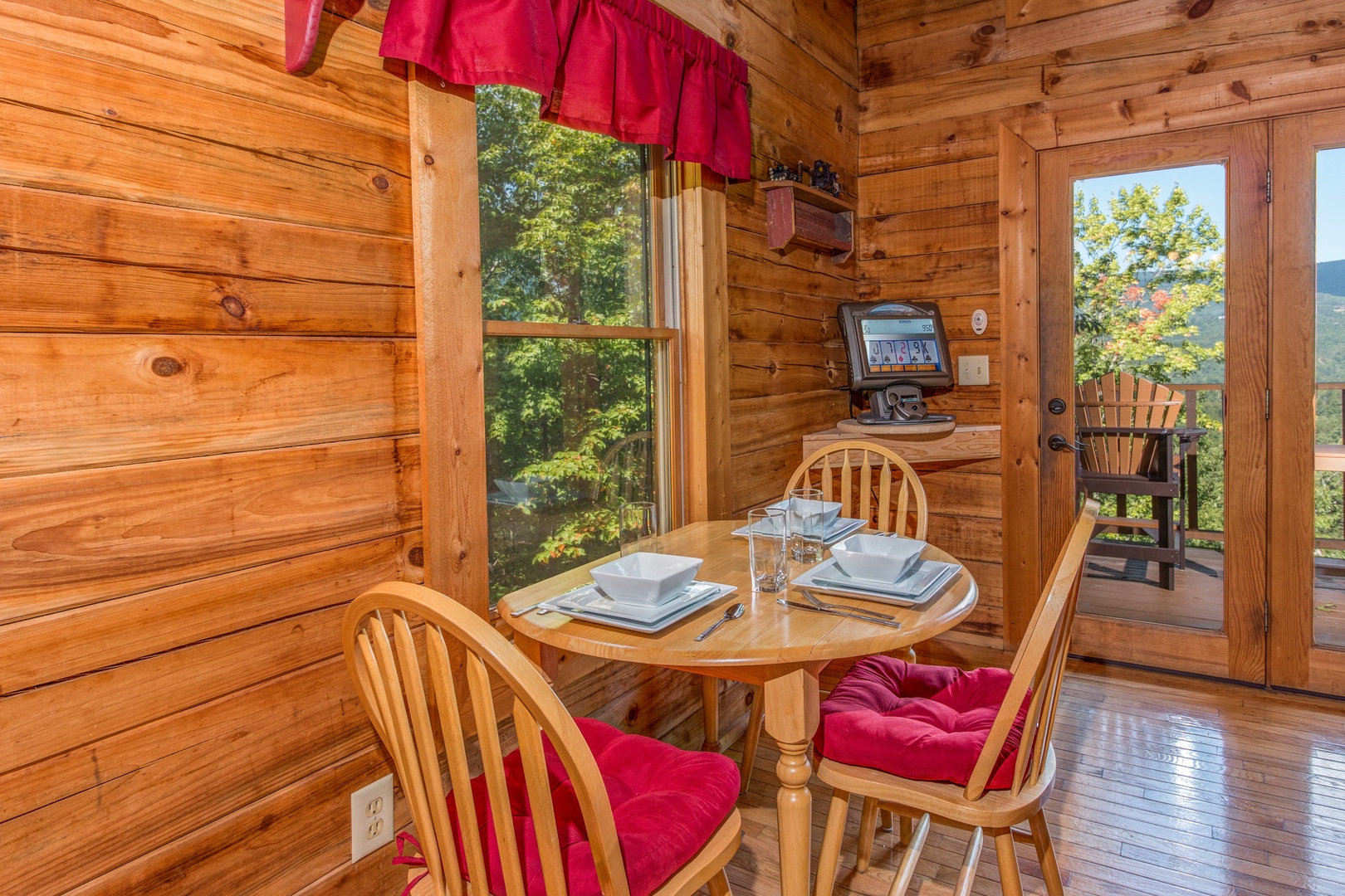 Dining table for three at Cupid's Crossing, a 1 bedroom cabin rental located in Pigeon Forge
