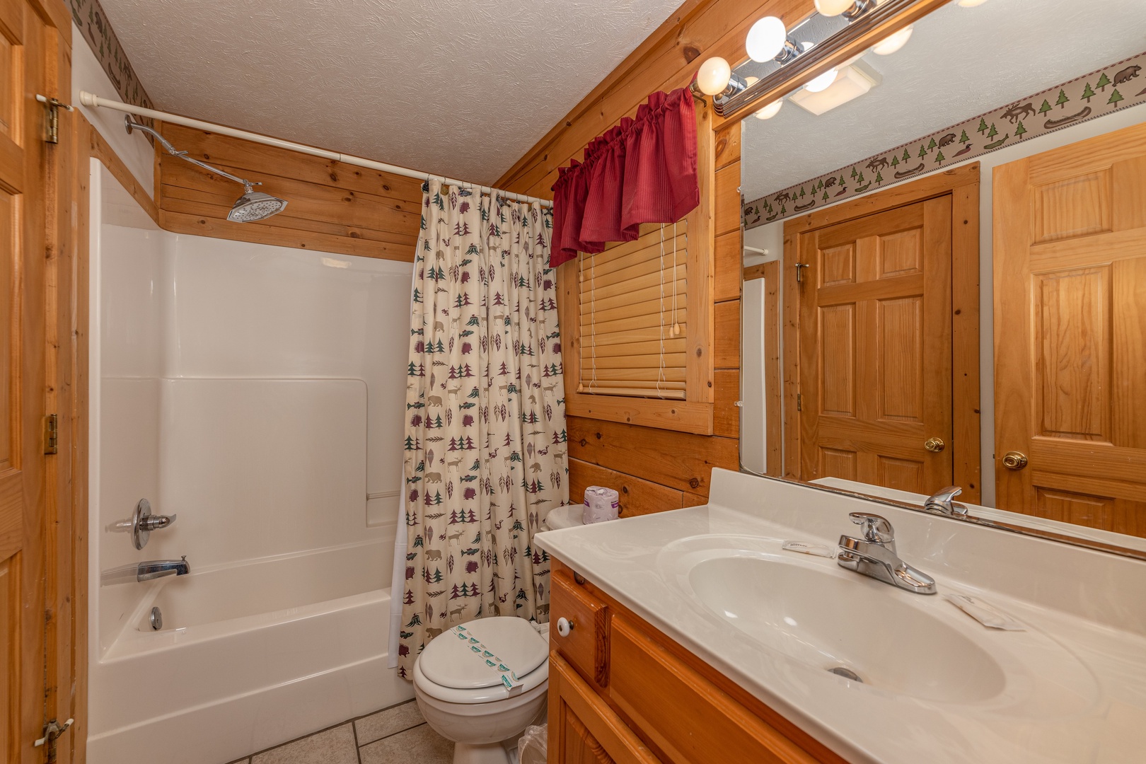 Bathroom with tub and shower at Cub's Crossing, a 3 bedroom cabin rental located in Gatlinburg