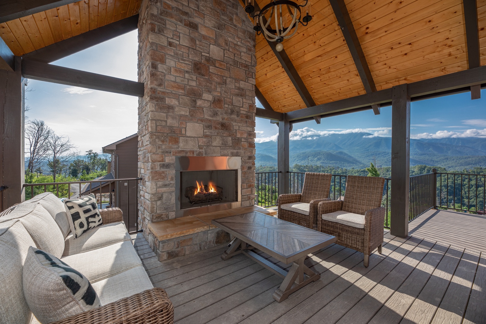 Outdoor fireplace at Mountain Celebration, a 4 bedroom cabin rental located in Gatlinburg