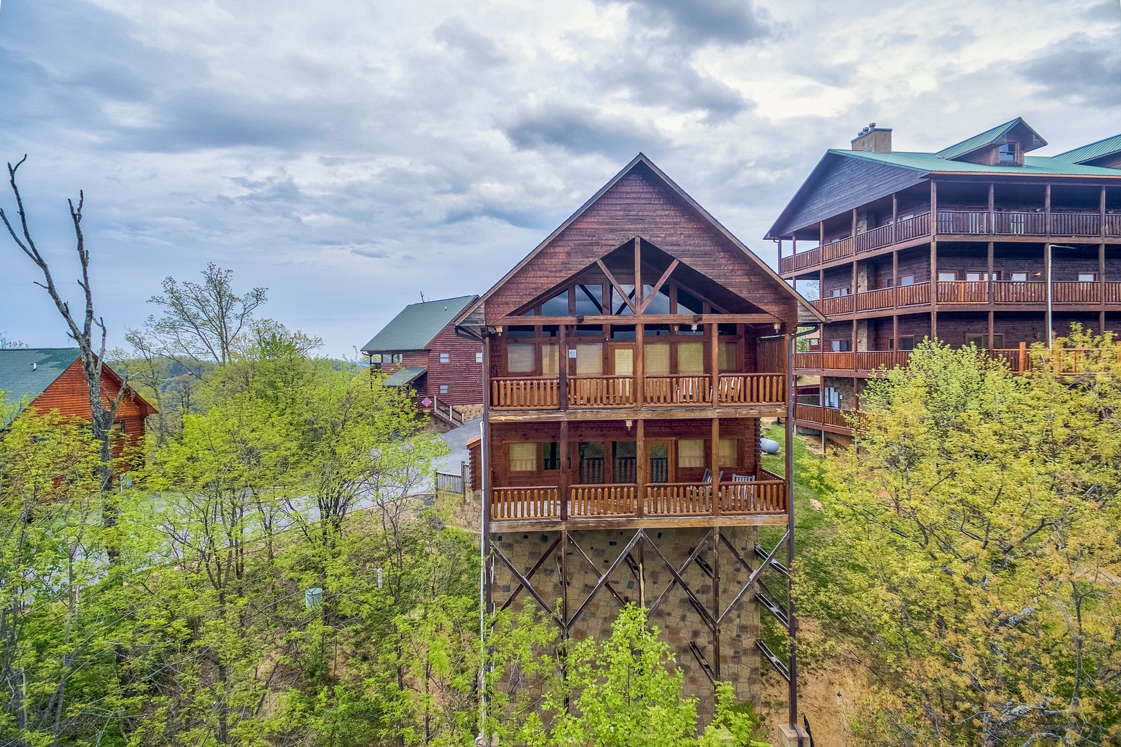 Looking back at the cabin from a drone at Howlin' in the Smokies, a 2 bedroom cabin rental located in Pigeon Forge