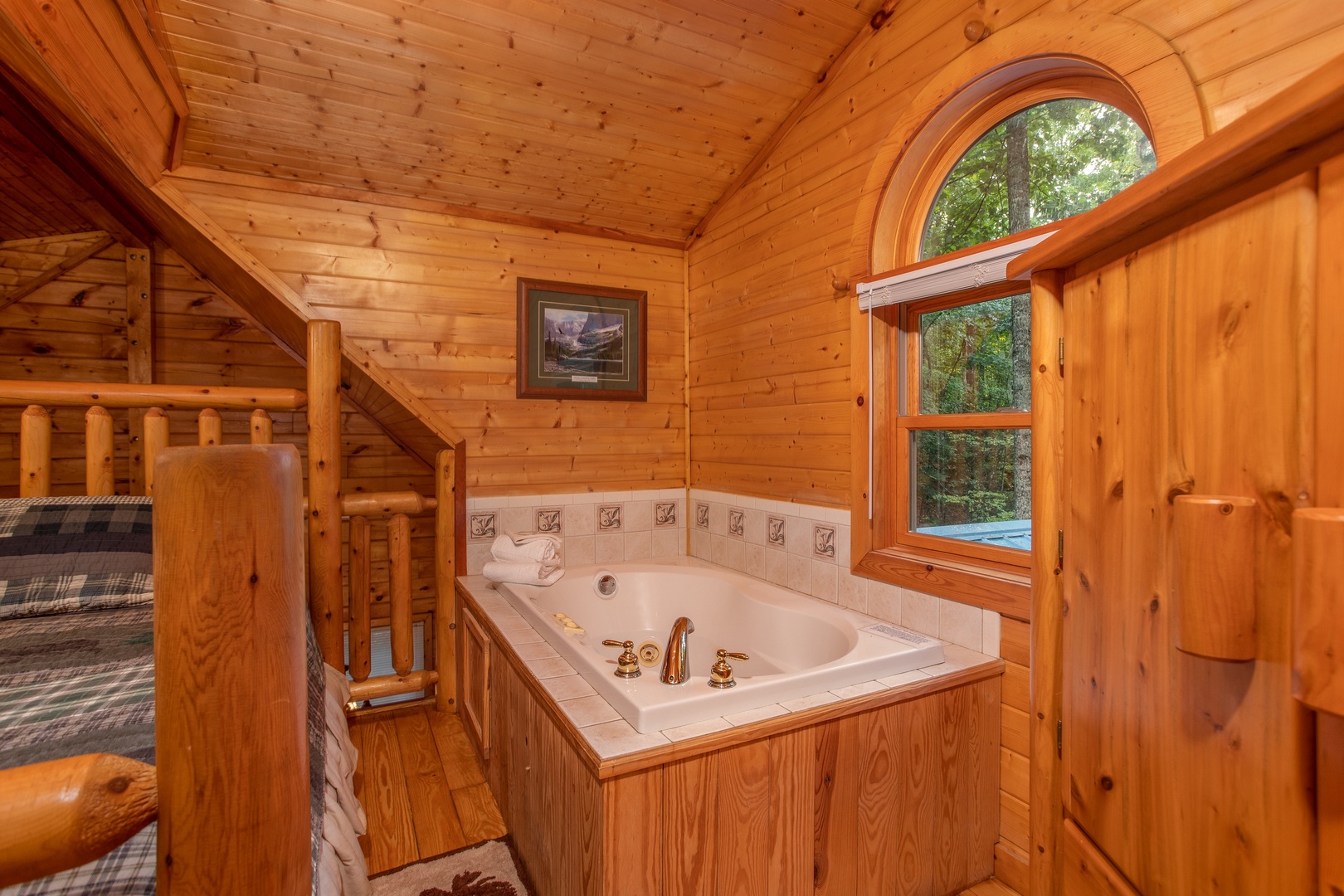 Jacuzzi in the loft room at Lazy Mountain Retreat, a 1 bedroom cabin rental located in Gatlinburg