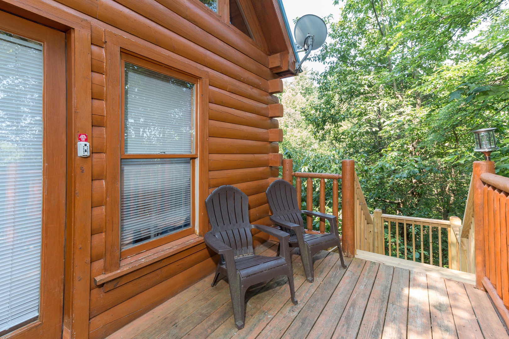 Front porch with adirondack chairs at Bearstone cabin, a 1 bedroom cabin rental located in Gatlinburg