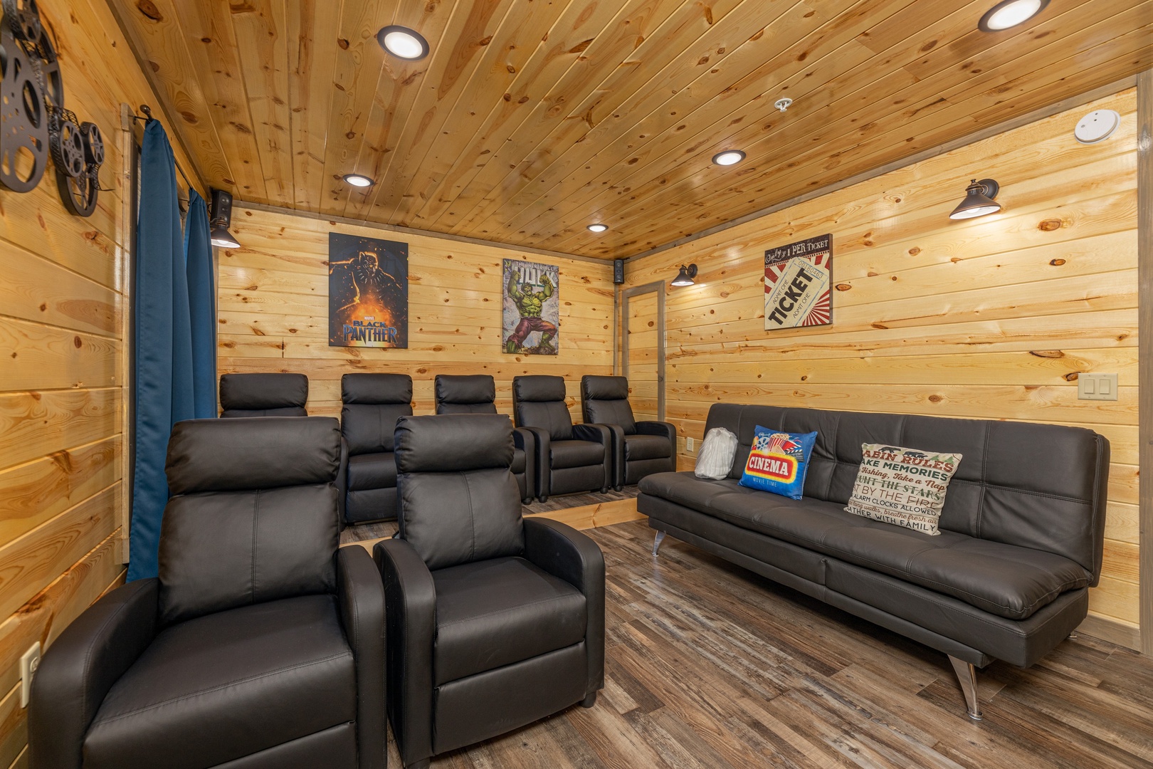 Seating in the home theater at Everly's Splash, a 4 bedroom cabin rental located in Pigeon Forge
