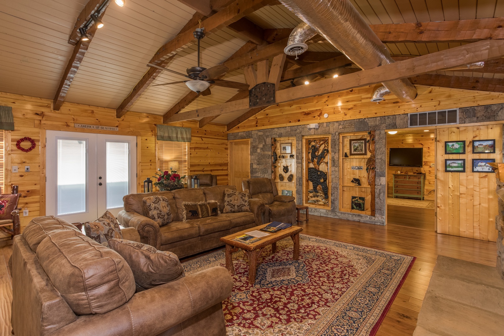 Two love seats and chairs in the living room at Rustic Ranch, a 2 bedroom cabin rental located in Pigeon Forge