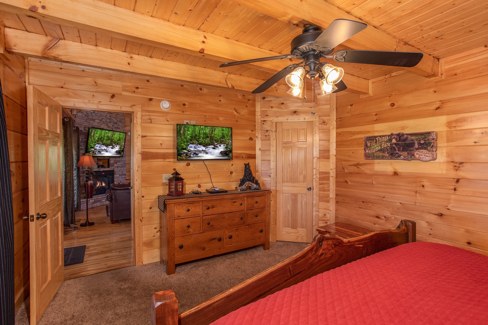 Wall-mounted television and dresser at Bears Eye View, a 2-bedroom cabin rental located in Pigeon Forge