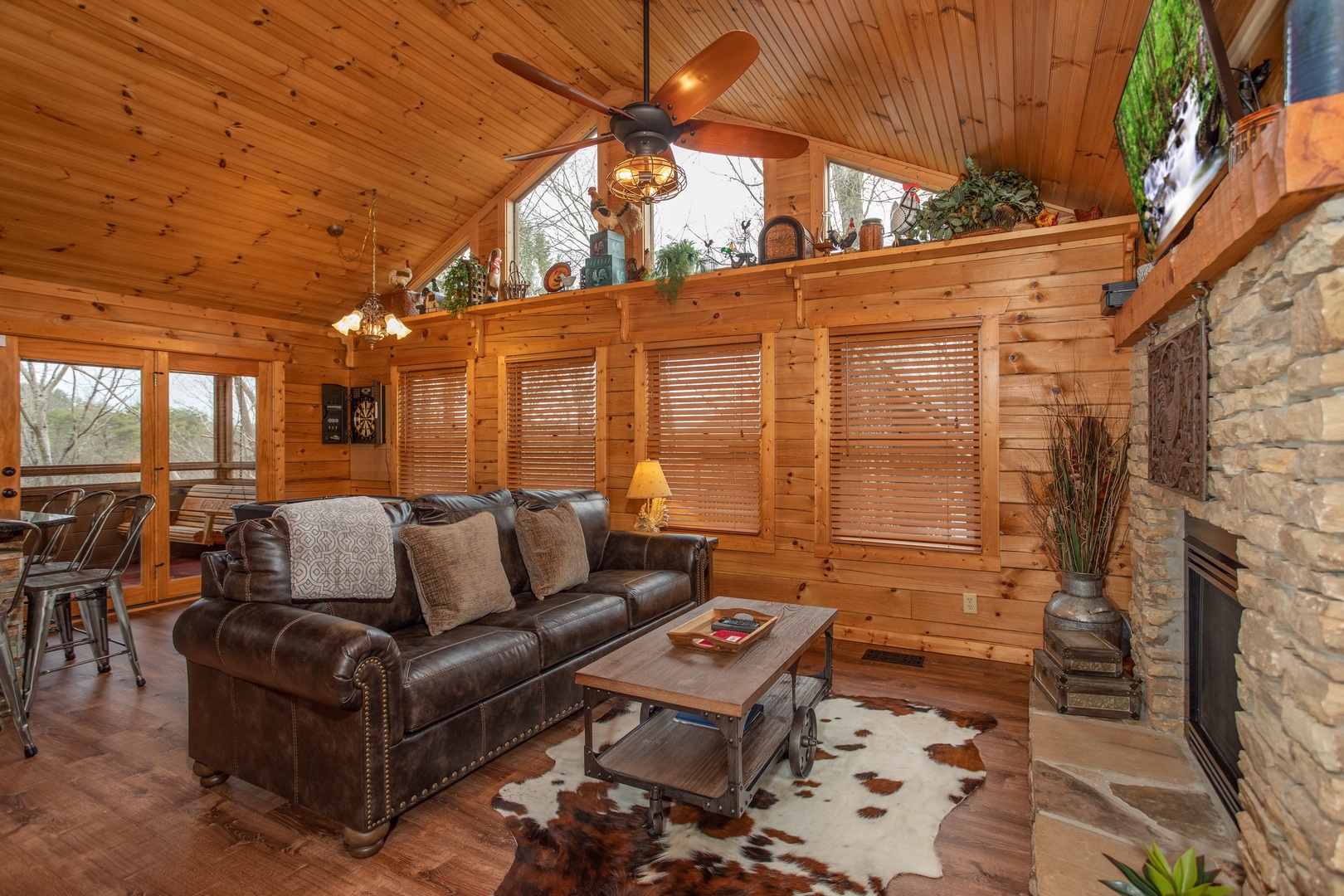 Sofa in the living room at Fowl Play, a 1 bedroom cabin rental located in Pigeon Forge