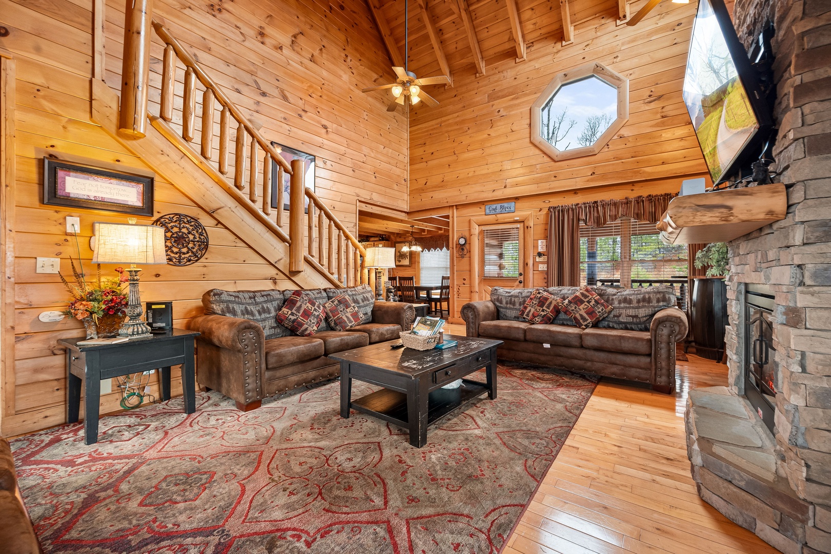 Queen sleeper sofa and additional seating in the living room at Better View, a 4 bedroom cabin rental located in Pigeon Forge