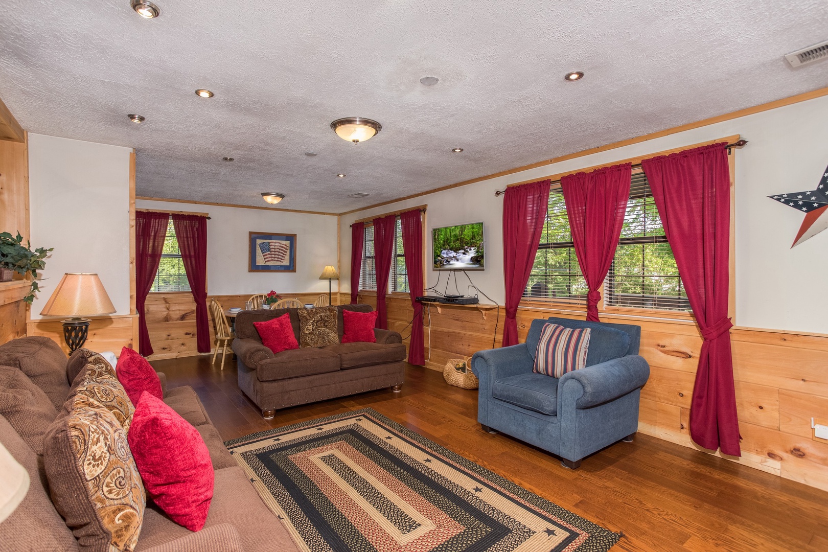 Sofa, loveseat, and chair in the living room at Patriot Pointe, a 5 bedroom cabin rental located in Pigeon Forge