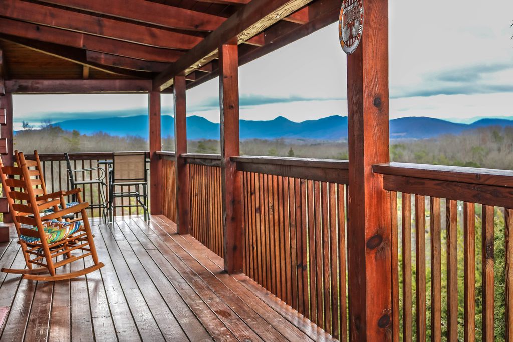 Mountain views from the covered deck at Eagle's Nest, a 2-bedroom cabin rental located in Sevierville