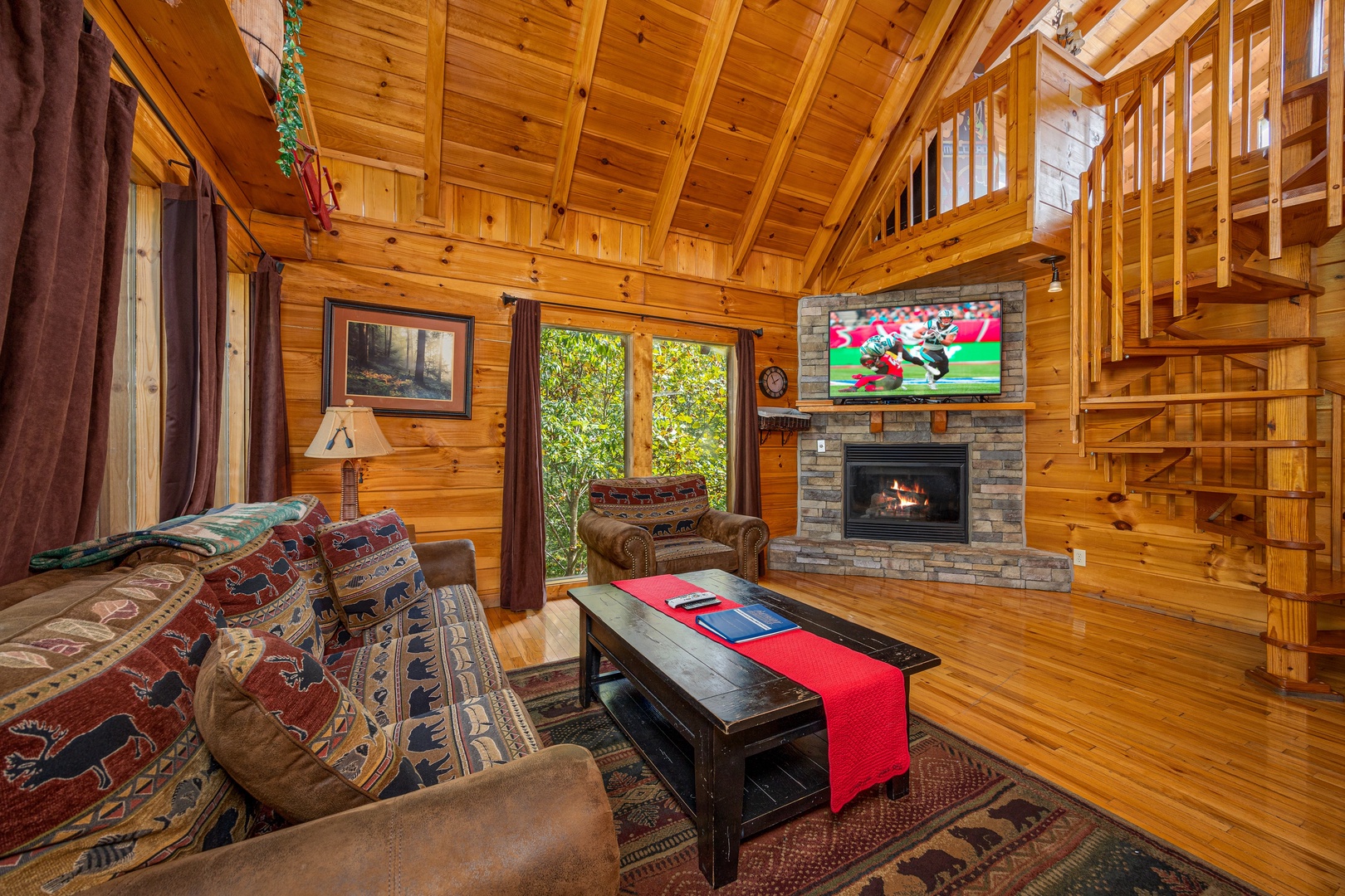 Living room seating and fireplace at The Great Outdoors, a 3 bedroom cabin rental located in Pigeon Forge