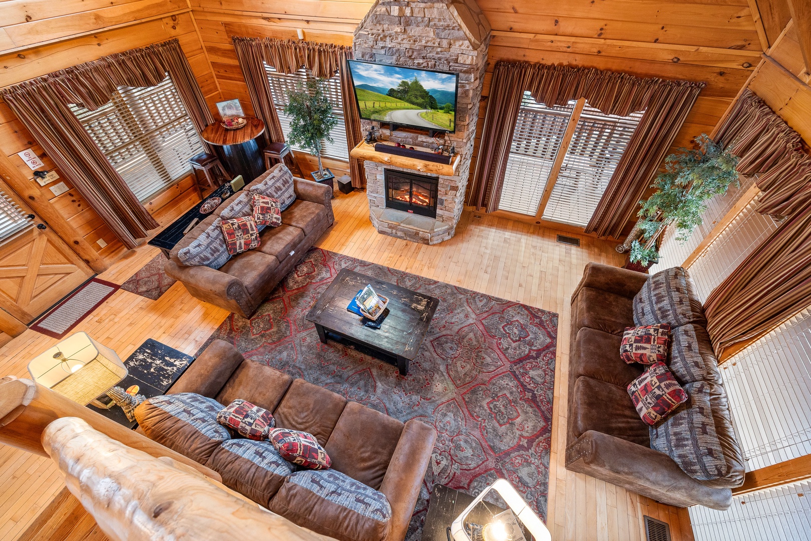Looking down on the living room from the upper floor at Better View, a 4 bedroom cabin rental located in Pigeon Forge