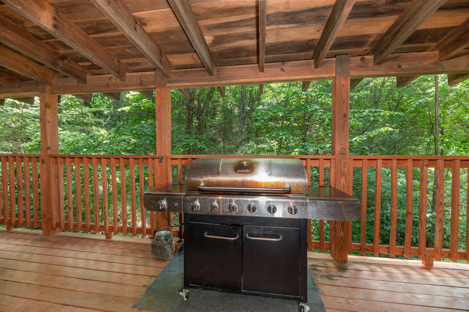 Grill on a covered deck at Misty Mountain Escape, a 2 bedroom cabin rental located in Gatlinburg