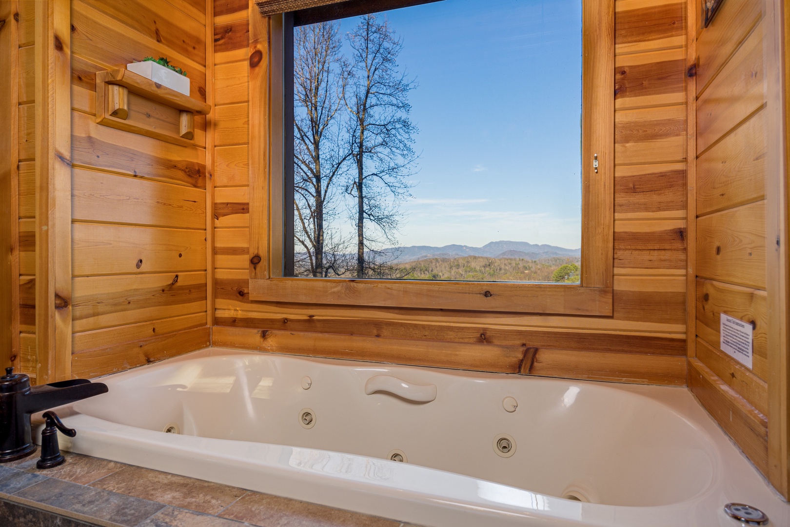 Jacuzzi with mountain view at Gone To Therapy, a 2 bedroom cabin rental located in Gatlinburg