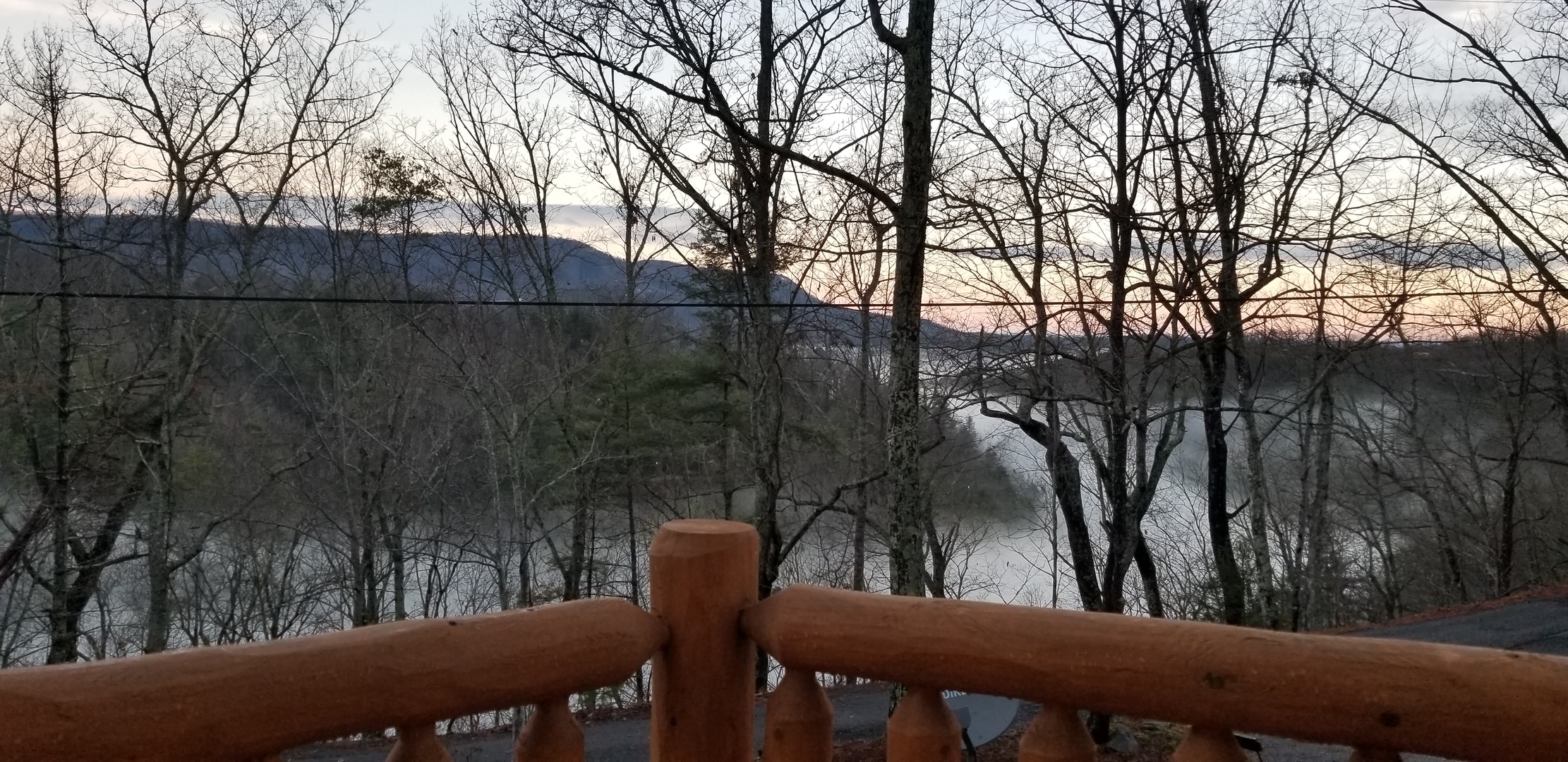 Winter mountain views through the trees at Forever Country, a 3-bedroom cabin rental located in Pigeon Forge