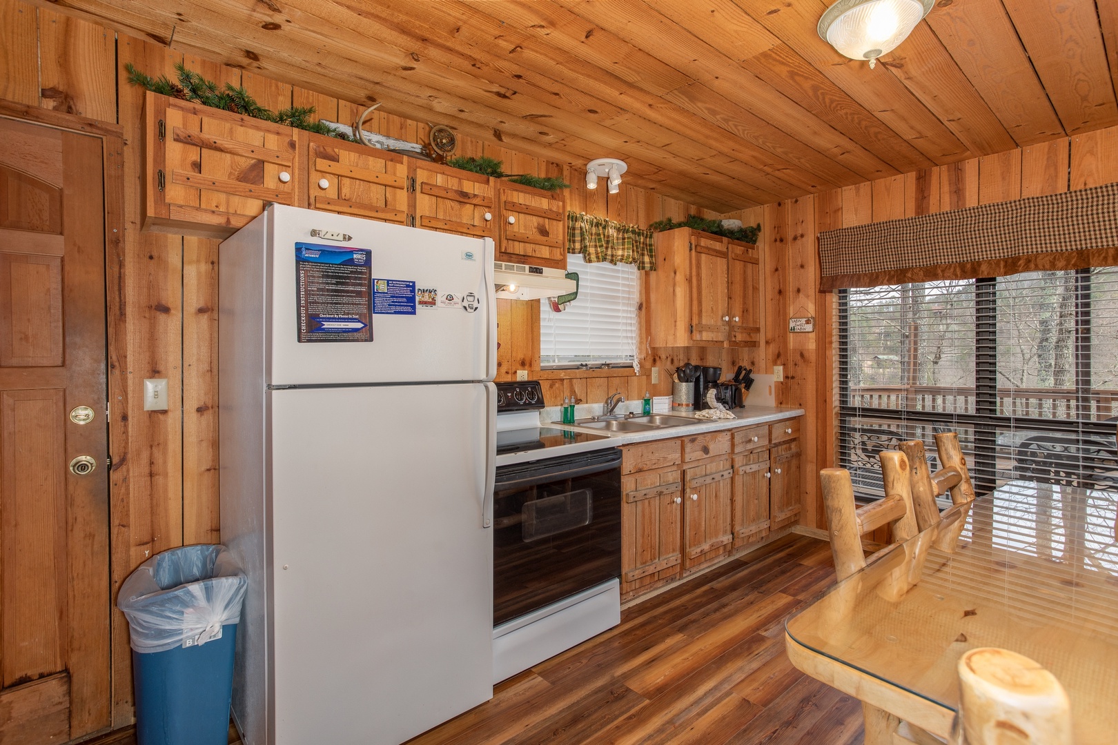 Kitchen with white appliances at Papa Bear, a 3 bedroom cabin in Pigeon Forge