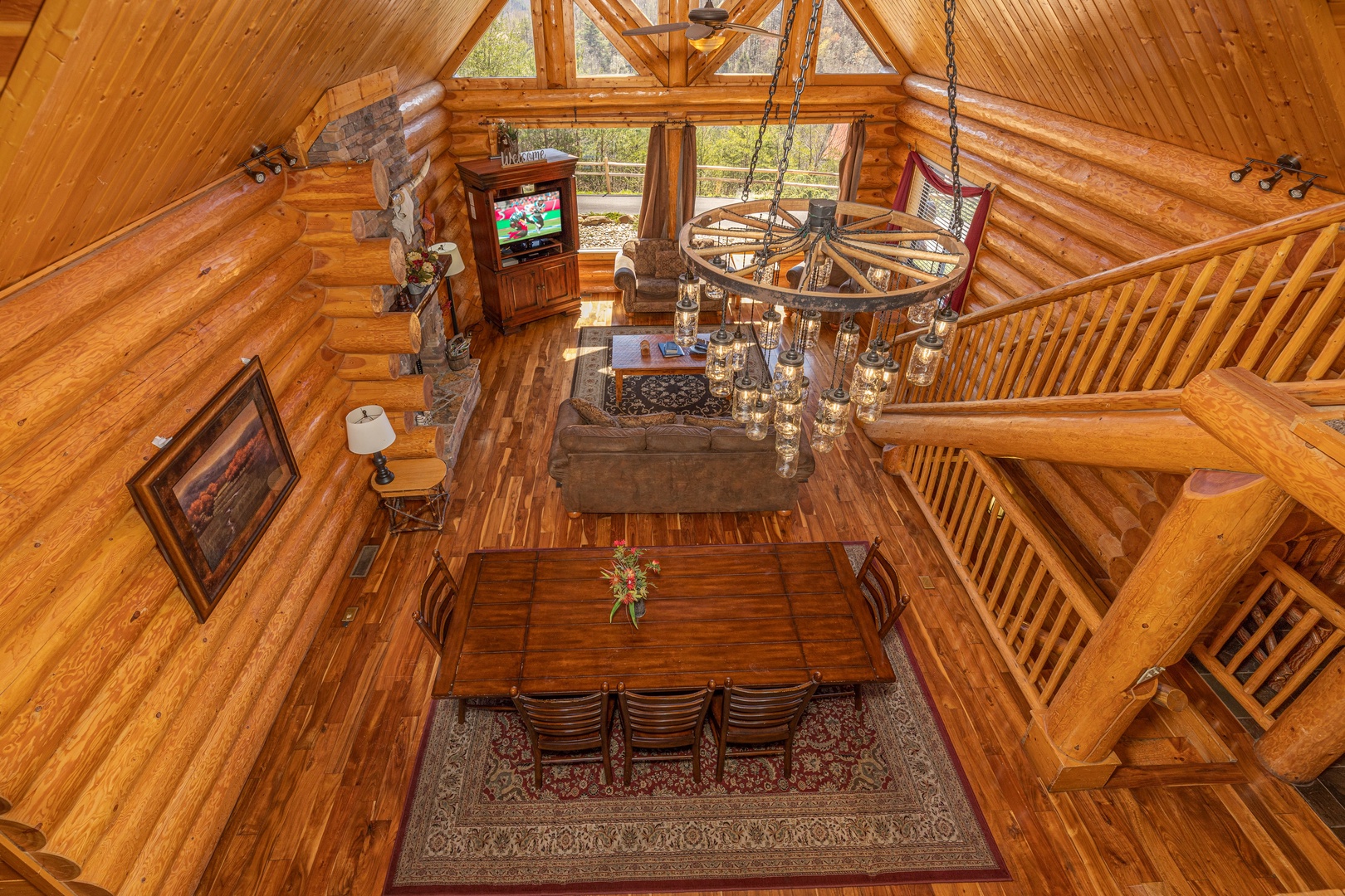 Looking down at the living room at God's Country, a 4 bedroom cabin rental located in Pigeon Forge