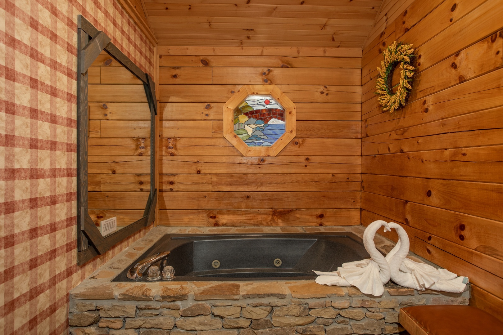 Jacuzzi tub in the bedroom at Fowl Play, a 1 bedroom cabin rental located in Pigeon Forge