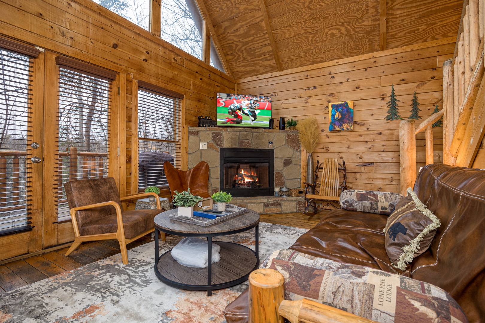 Living room and fireplace at Bearstone Cabin, a 1 bedroom cabin rental located in Gatlinburg