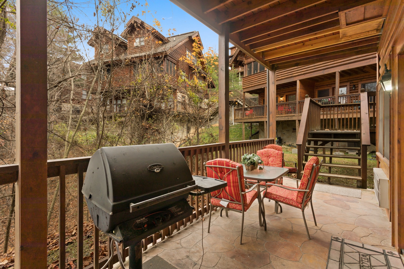 Patio with a grill and dining table at Starry Starry Night #725, a 2 bedroom cabin rental located in Pigeon Forge