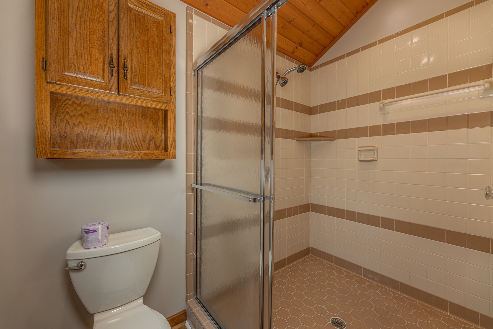 Shower in a bathroom at Cubs' Crib, a 3 bedroom cabin rental located in Gatlinburg