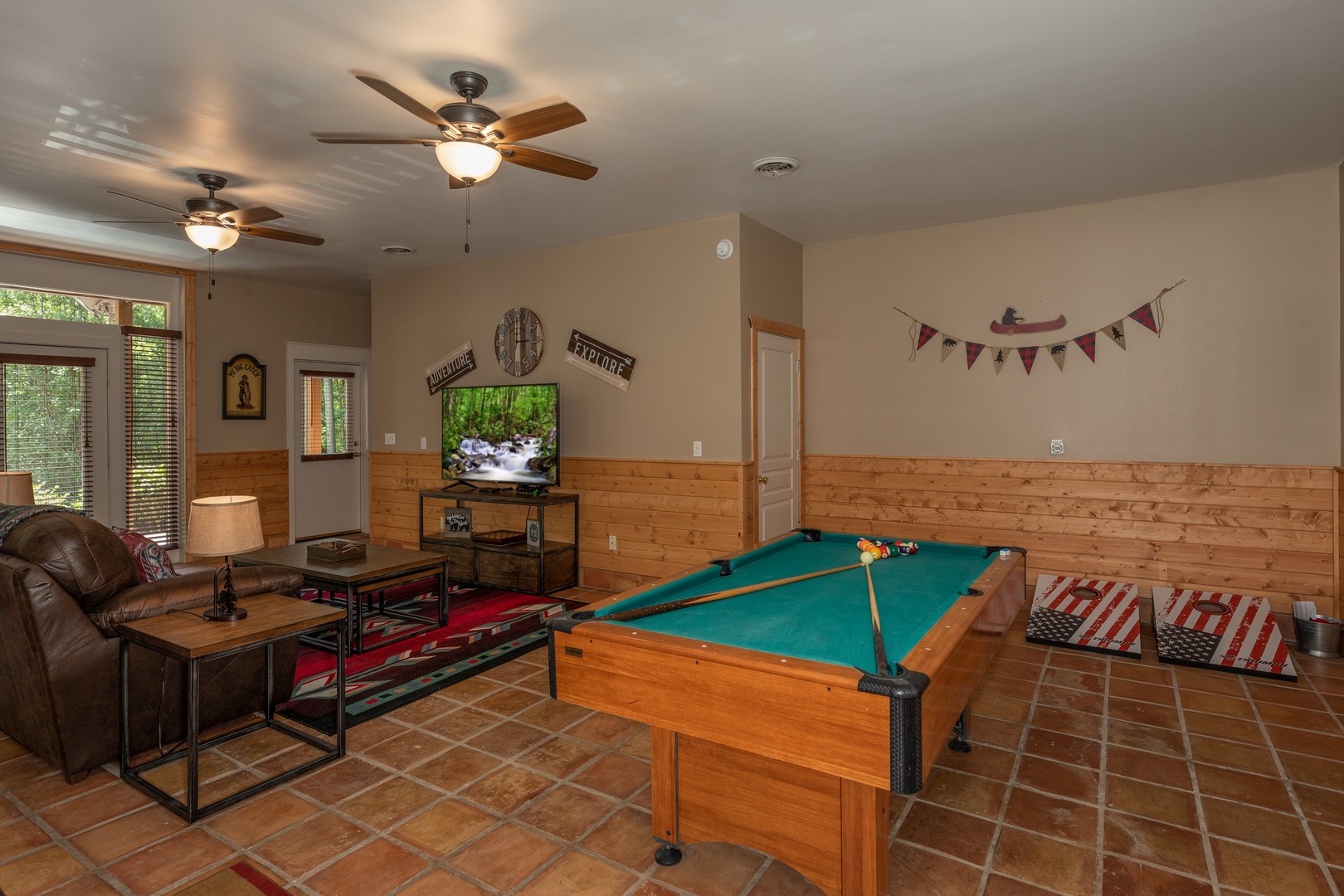 Pool table in the living room at Hawk's Heart Lodge, a 3 bedroom cabin rental located in Pigeon Forge