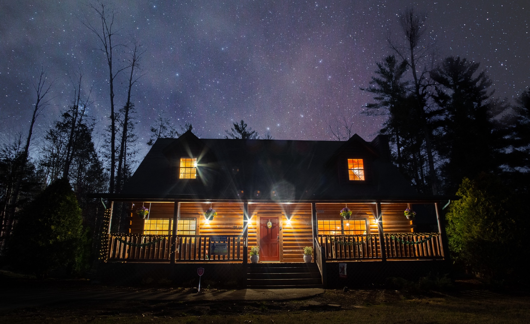 Exterior at Night at 3 Crazy Cubs, a 5 bedroom cabin rental located in pigeon forge