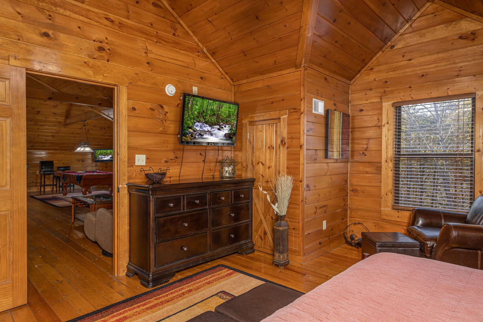 Dresser and TV in a bedroom at King of the Mountain, a 3 bedroom cabin rental located in Pigeon Forge