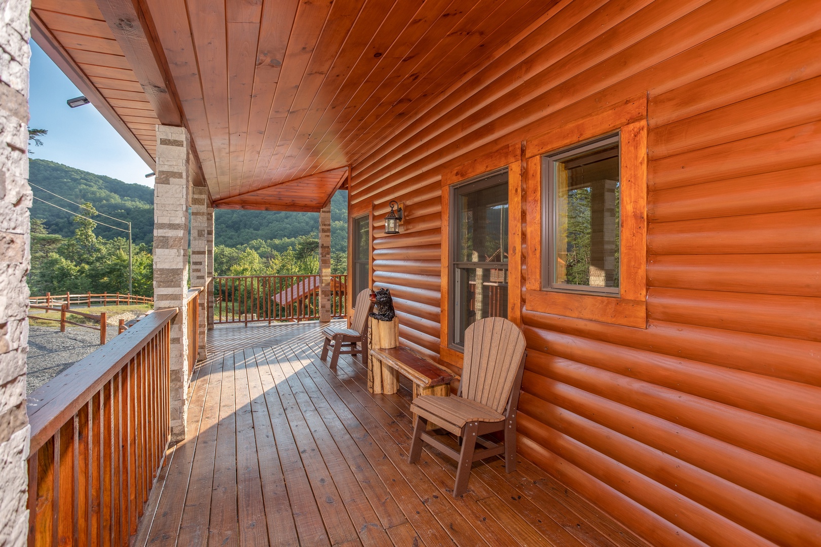 Porch with two chairs and a bench at Four Seasons Palace, a 5-bedroom cabin rental located in Pigeon Forge