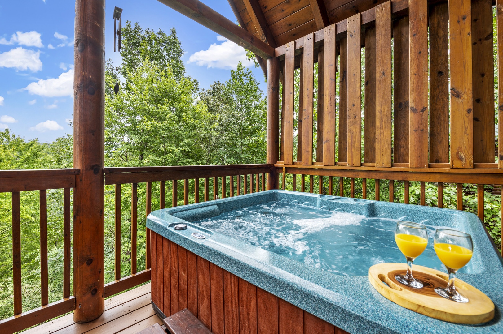 Hot tub on covered deck at Bear Sunrise