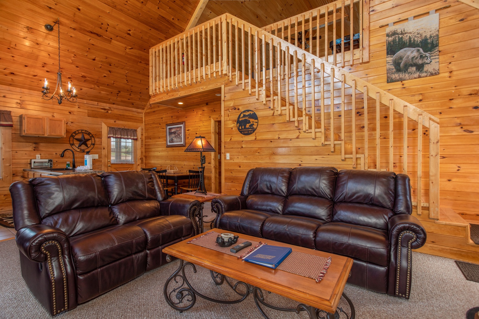 Living room with loveseat and sofa at Momma Bear, a 2 bedroom cabin rental located in Pigeon Forge