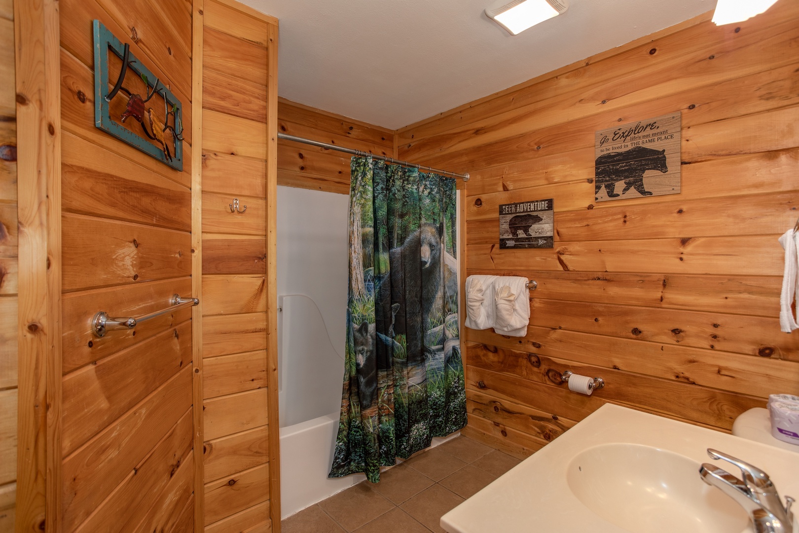 Bathroom with a tub and shower at Mountain Music, a 5 bedroom cabin rental located in Pigeon Forge