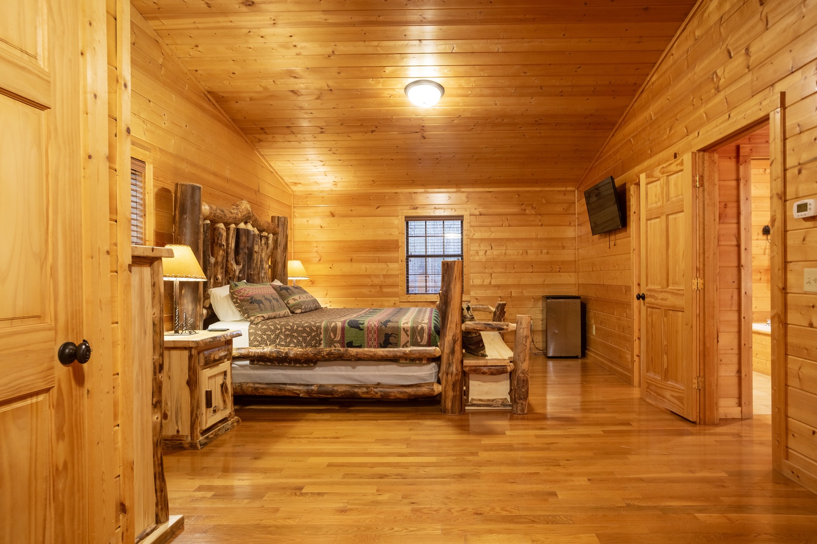Log bed at 3 Crazy Cubs, a 5 bedroom cabin rental located in pigeon forge