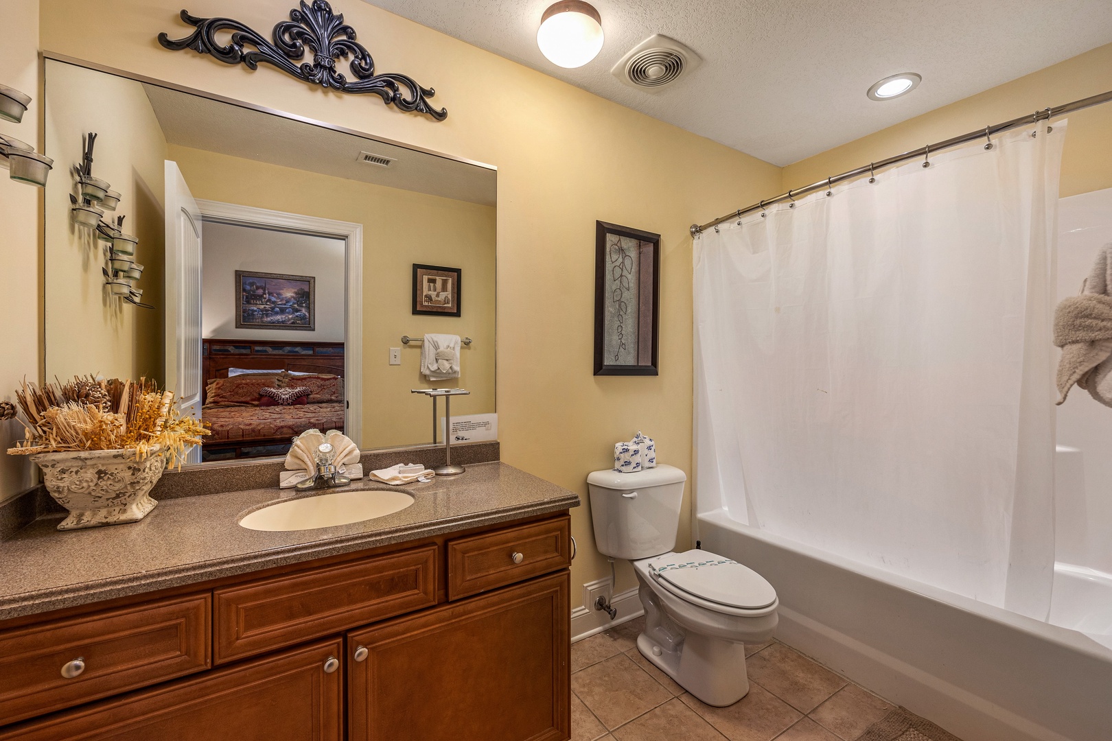 Bathroom with tub and shower at Heart of Gatlinburg, a 2 bedroom cabin rental located in Gatlinburg
