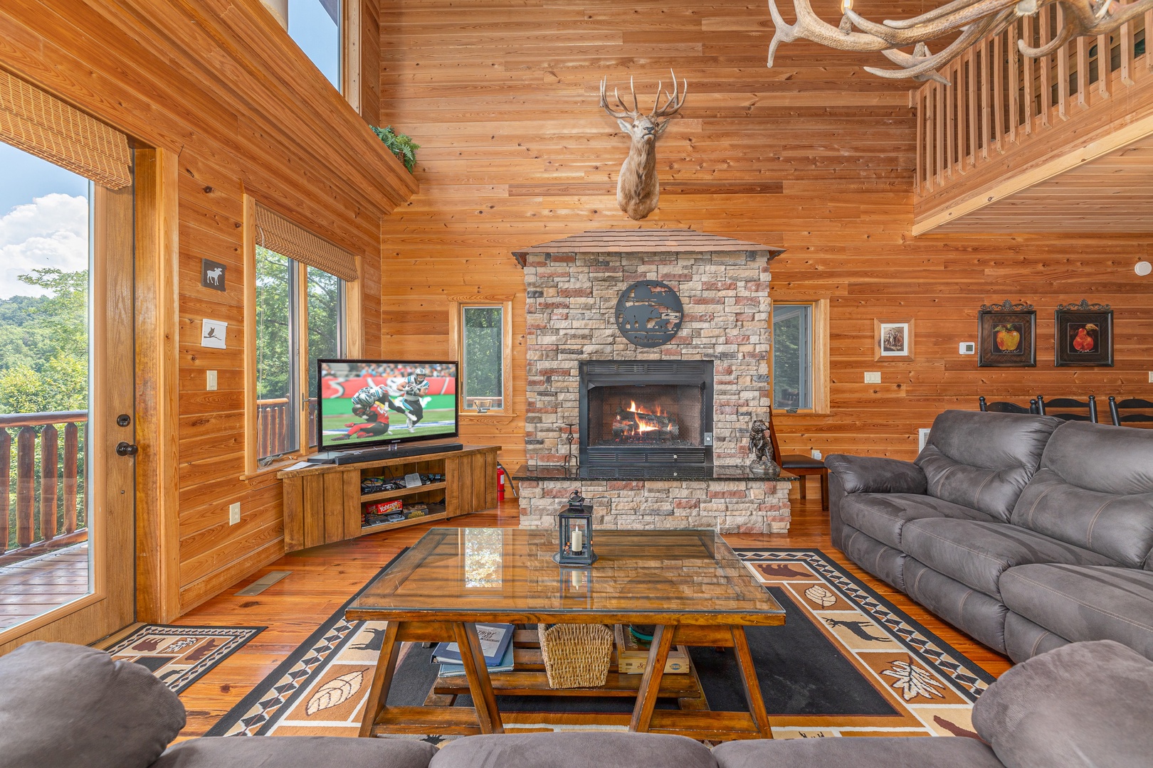 Living room and deck at Sky View, A 4 bedroom cabin rental in Pigeon Forge