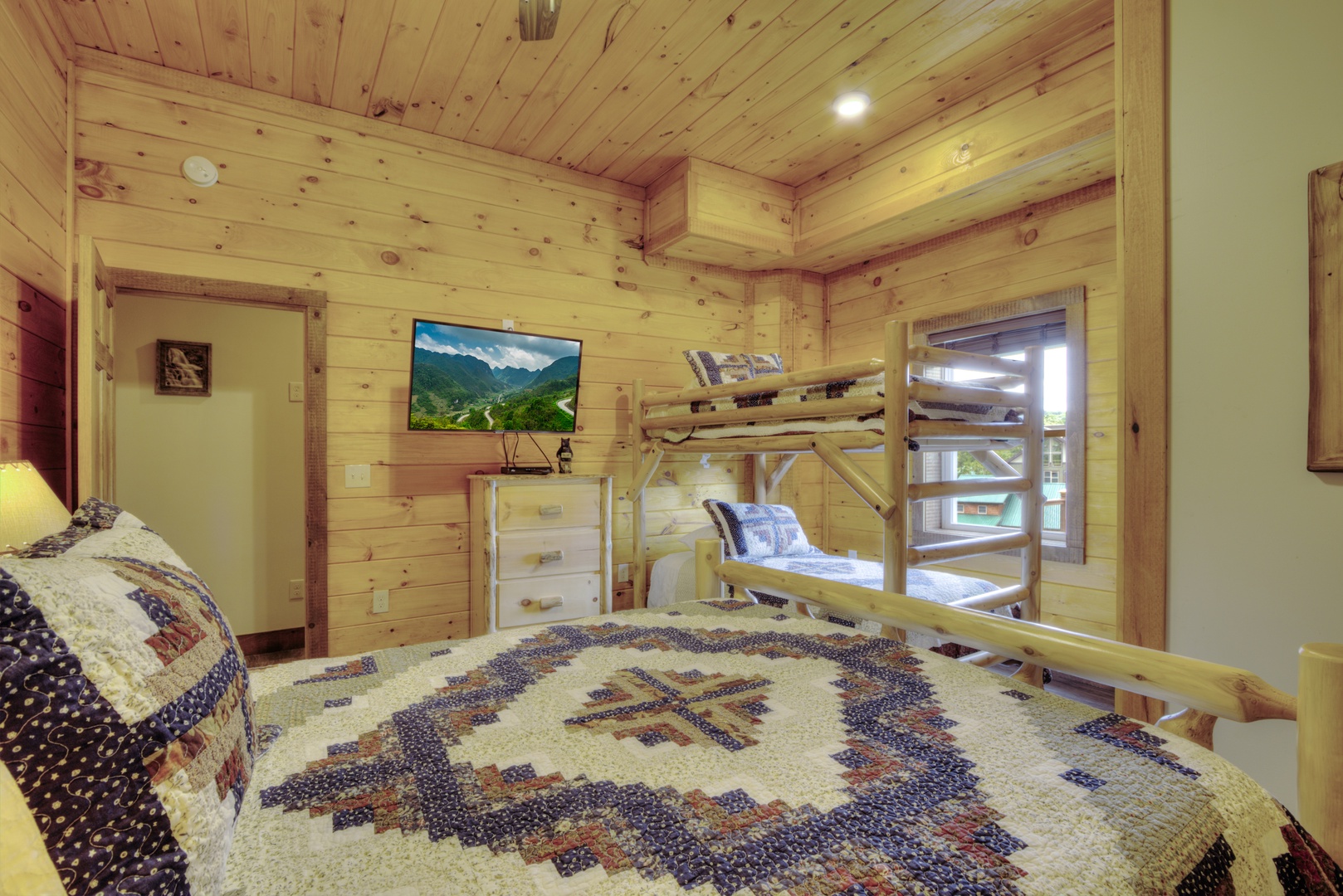 Log Bunk Bed and Flat Screen at The Best View Lodge, a 5 bedroom cabin rental located in gatlinburg