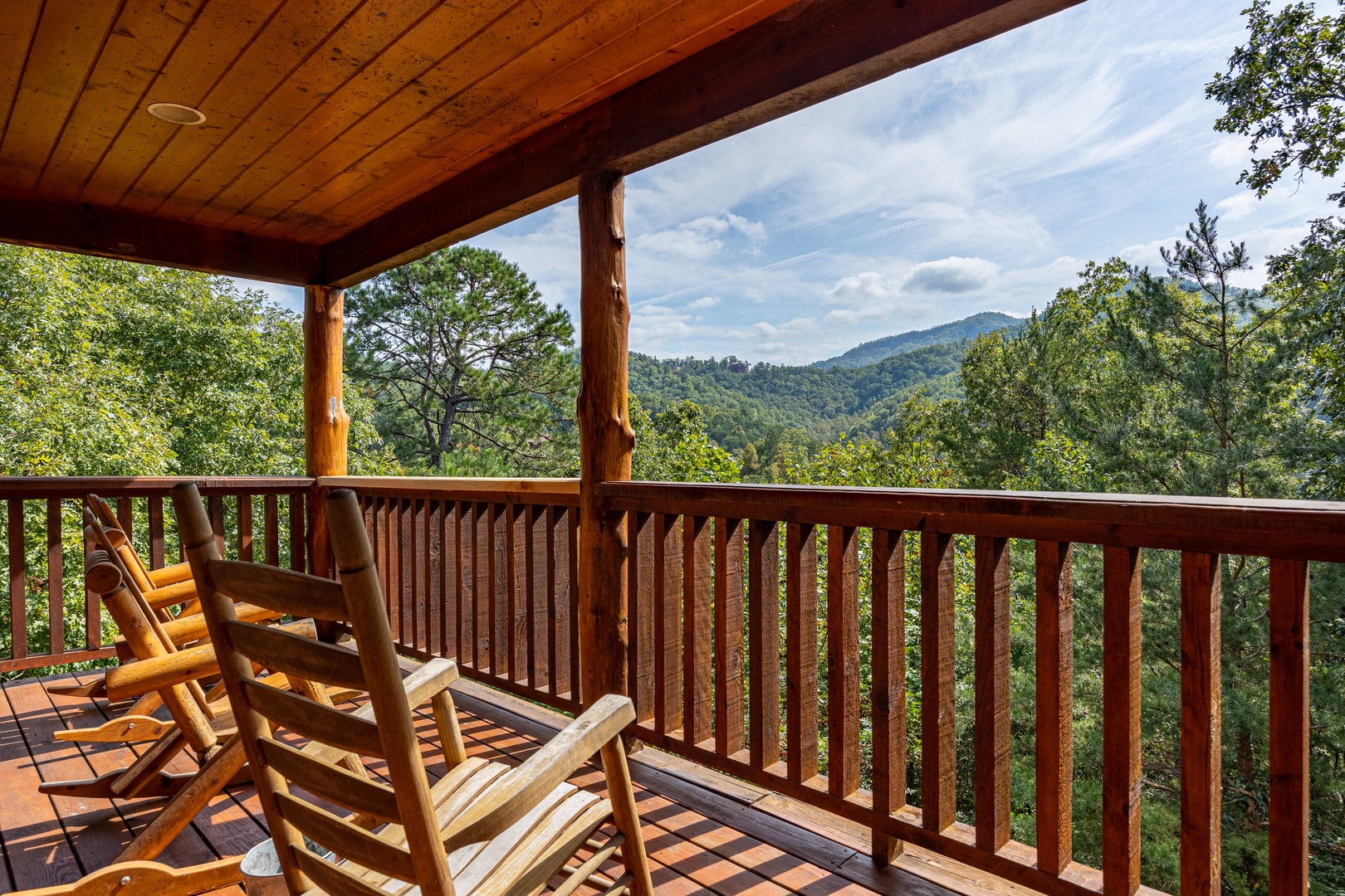 Deck seating with mountain view at The Great Outdoors, a 3 bedroom cabin rental located in Pigeon Forge