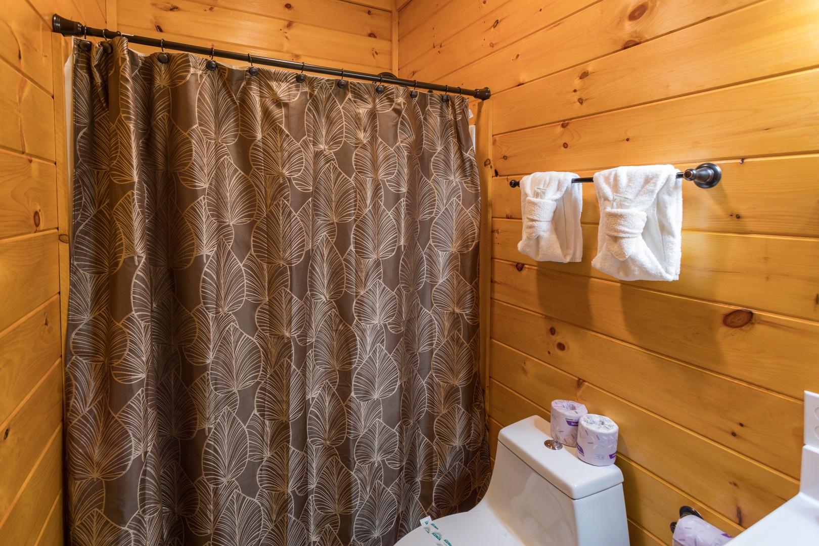 Bathroom with a tub and shower at Four Seasons Palace, a 5-bedroom cabin rental located in Pigeon Forge