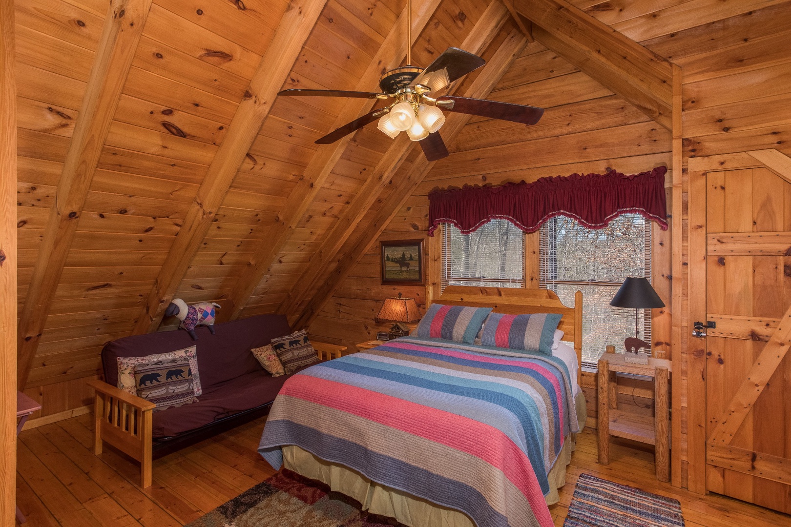 Queen-sized bed in the loft at Cloud 9, a 1-bedroom cabin rental located in Pigeon Forge