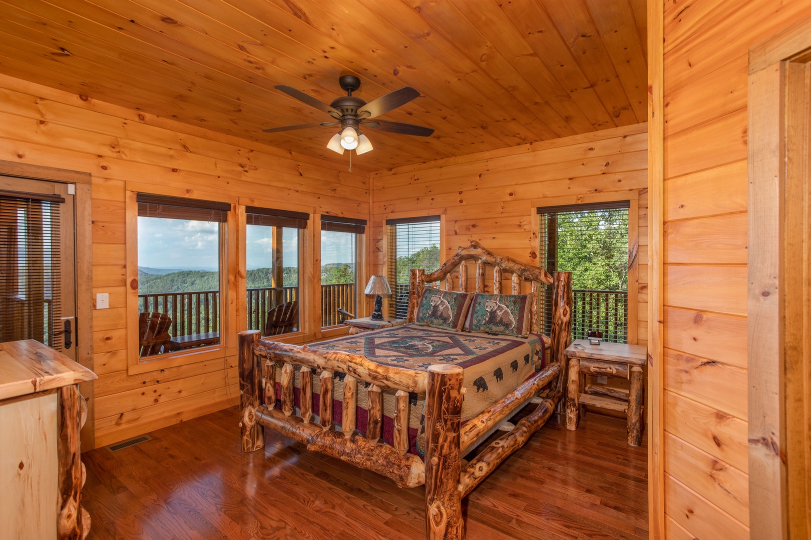 Bedroom with a log bed at Four Seasons Palace, a 5-bedroom cabin rental located in Pigeon Forge