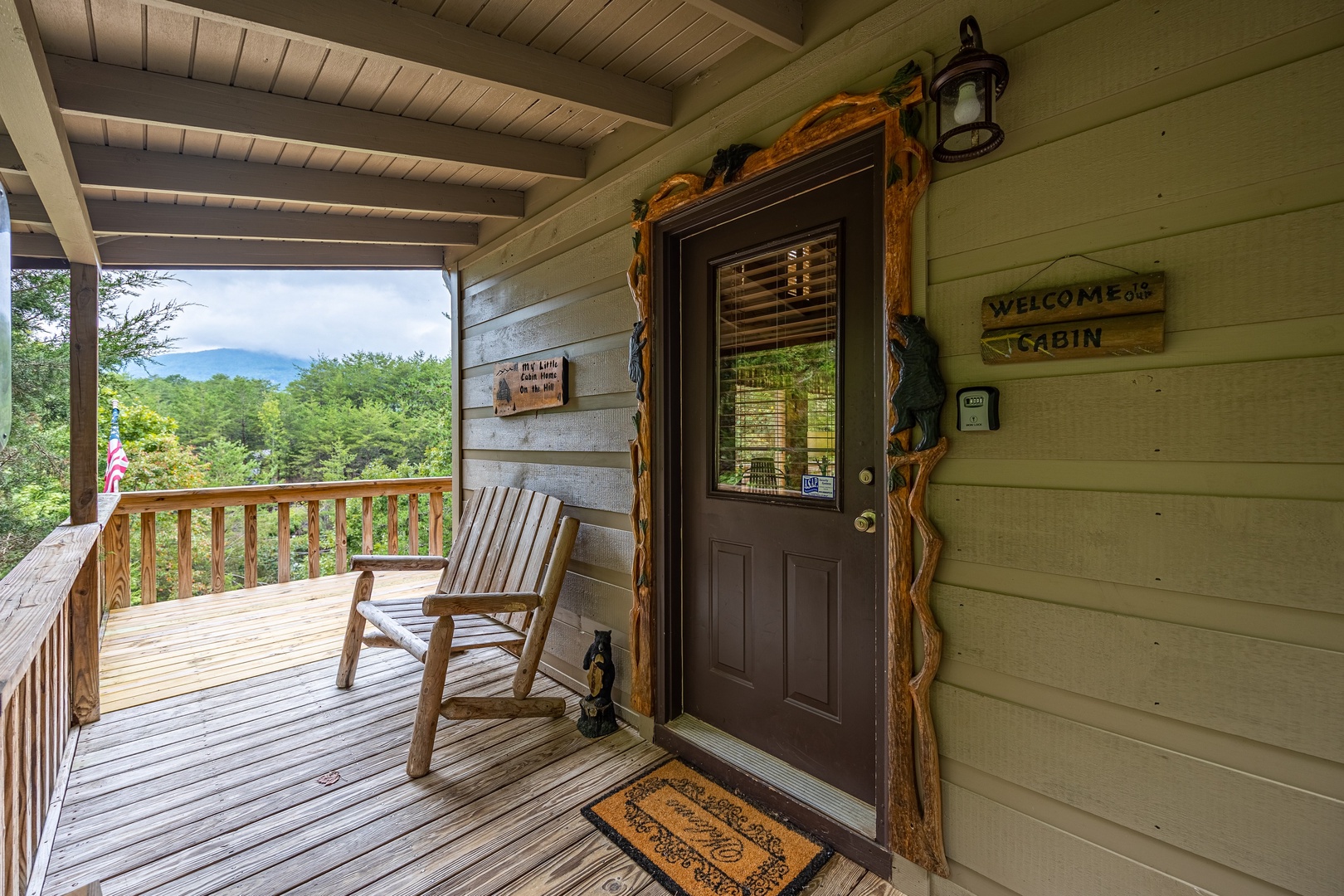 Porch with loveseat bench at Cabin On The Hill, a 1 bedroom cabin rental located in Pigeon Forge