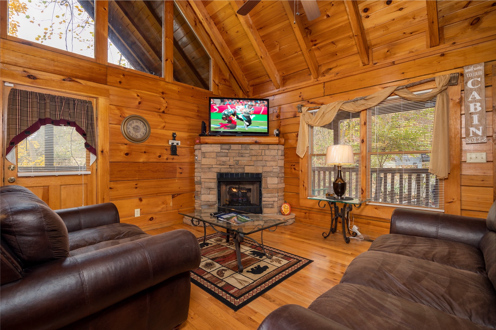 Livingroom with Flat Screen TV and Fireplace and window at Enchanted Forest