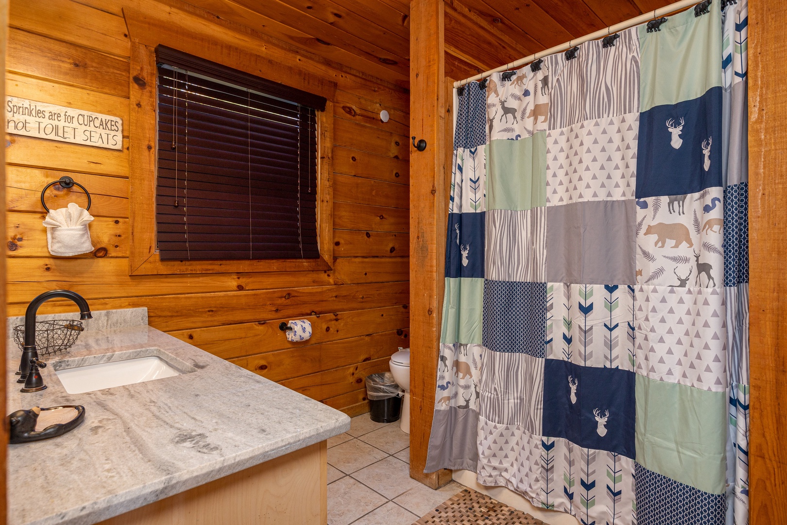 Bathroom with bath/shower combo at Bear Feet Retreat, a 1 bedroom cabin rental located in pigeon forge