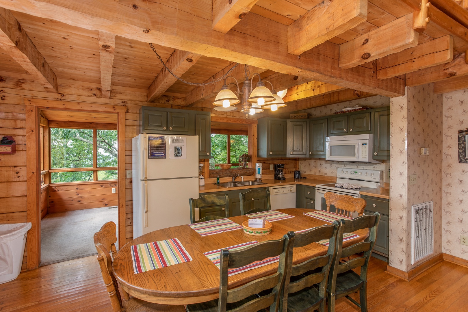 Eat-in kitchen with dining space for seven at Cabin in the Clouds, a 3-bedroom cabin rental located in Pigeon Forge