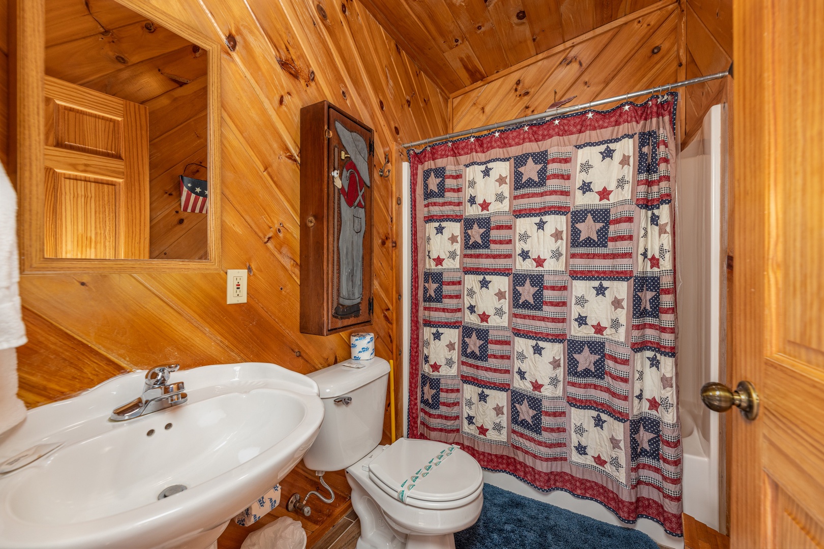 Bathroom with tub and shower at Hatcher Mountain Retreat a 2 bedroom cabin rental located in Pigeon Forge