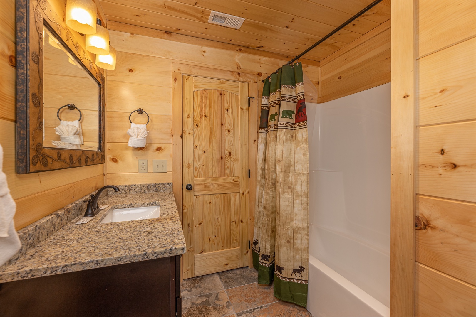 Bathroom with a tub and shower at Bessy Bears Cabin, a 2 bedroom cabin rental located inGatlinburg