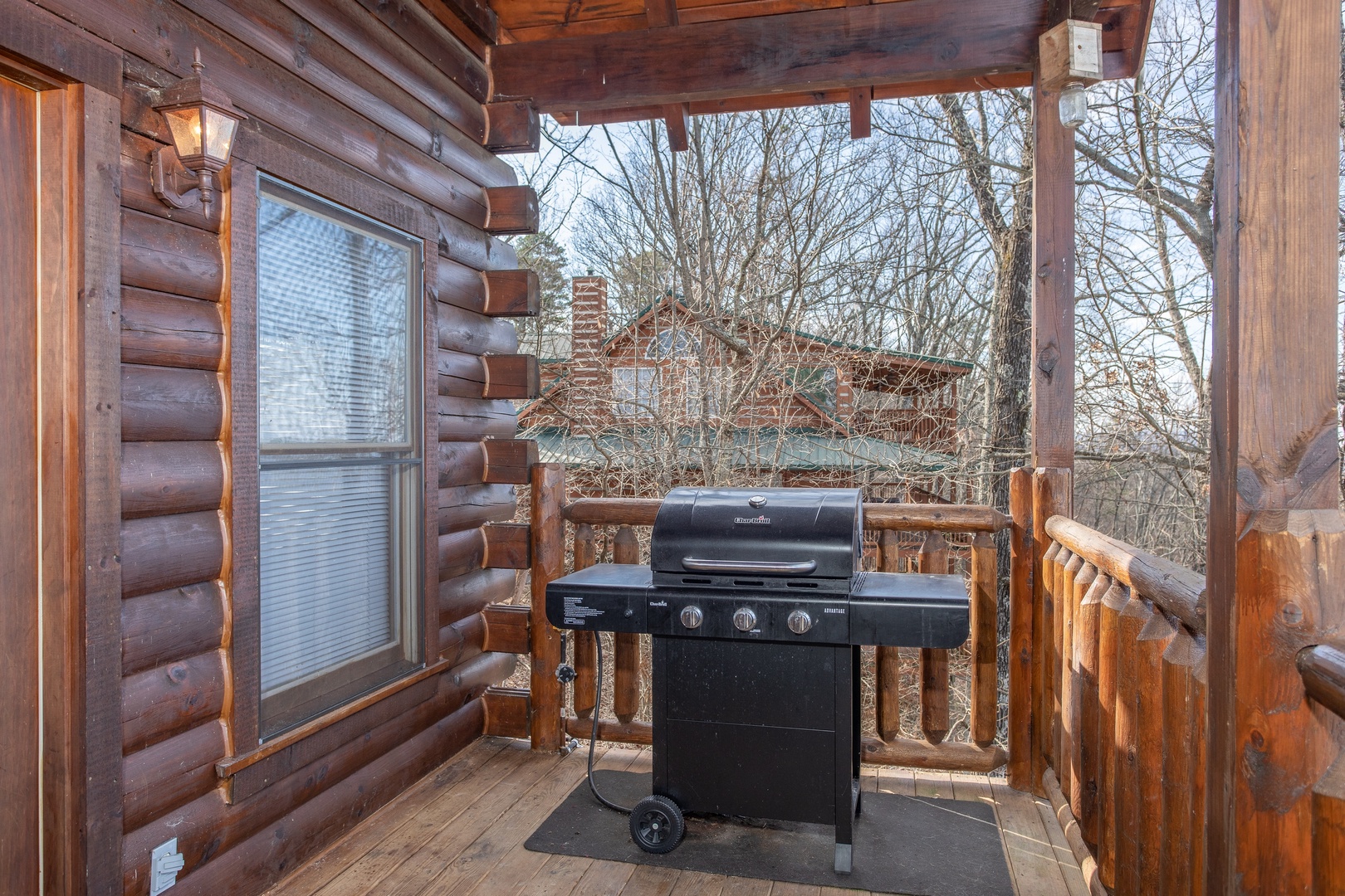 Propane grill on a covered deck at 5 Star View, a 3 bedroom cabin rental located in Gatlinburg