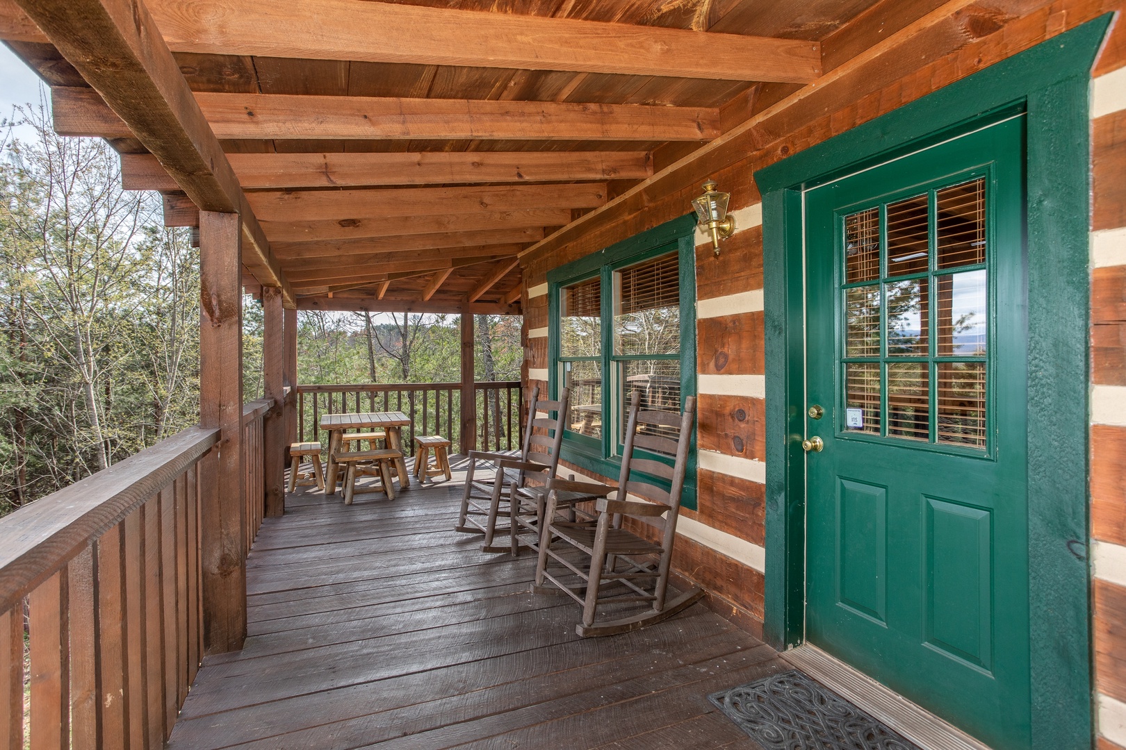 Front porch with rocking chairs at Blue Mountain Views, a 1 bedroom cabin rental located in Pigeon Forge
