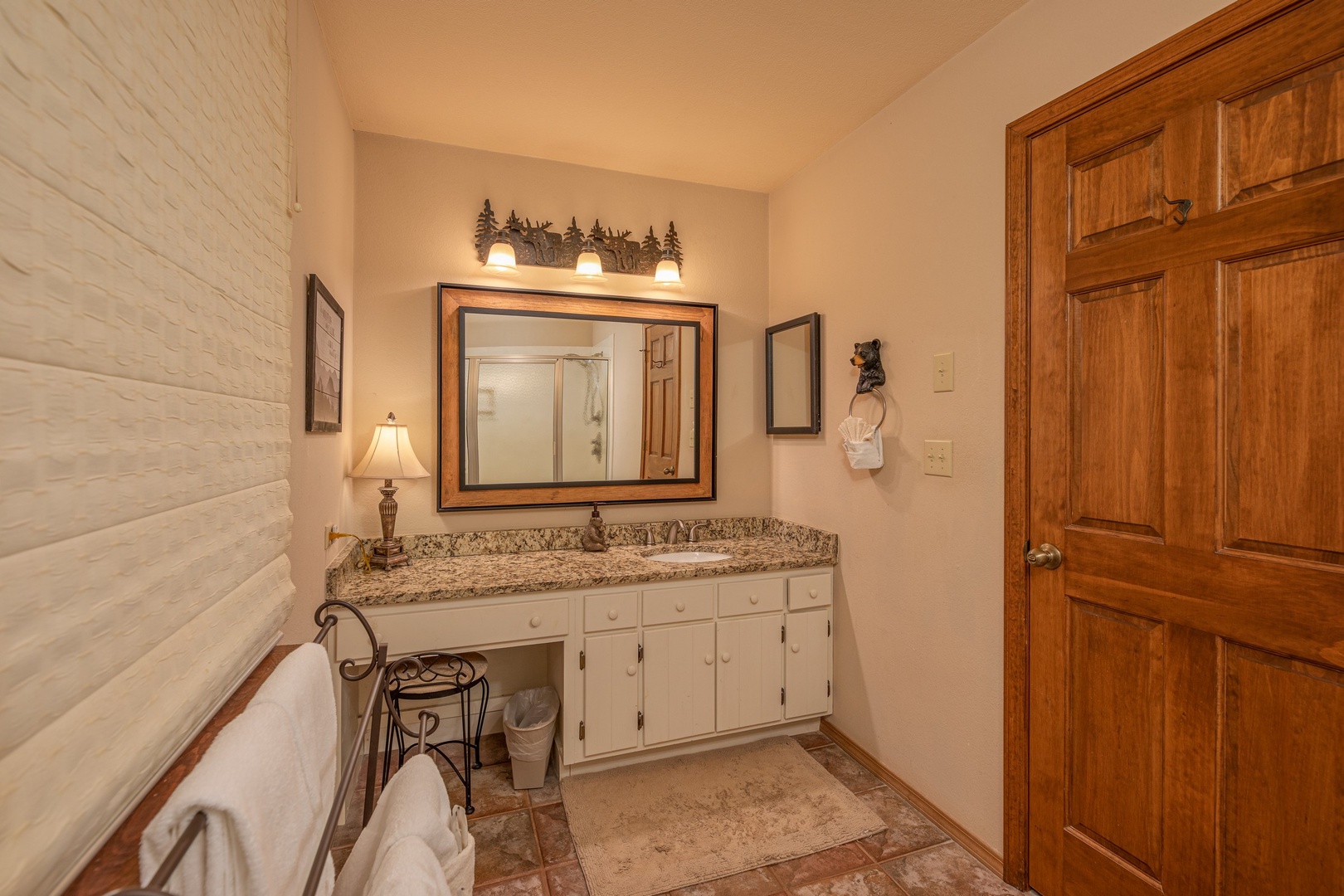 Vanity and dressing area in a bathroom at Lazy Bear Retreat, a 4 bedroom cabin rental located in Pigeon Forge