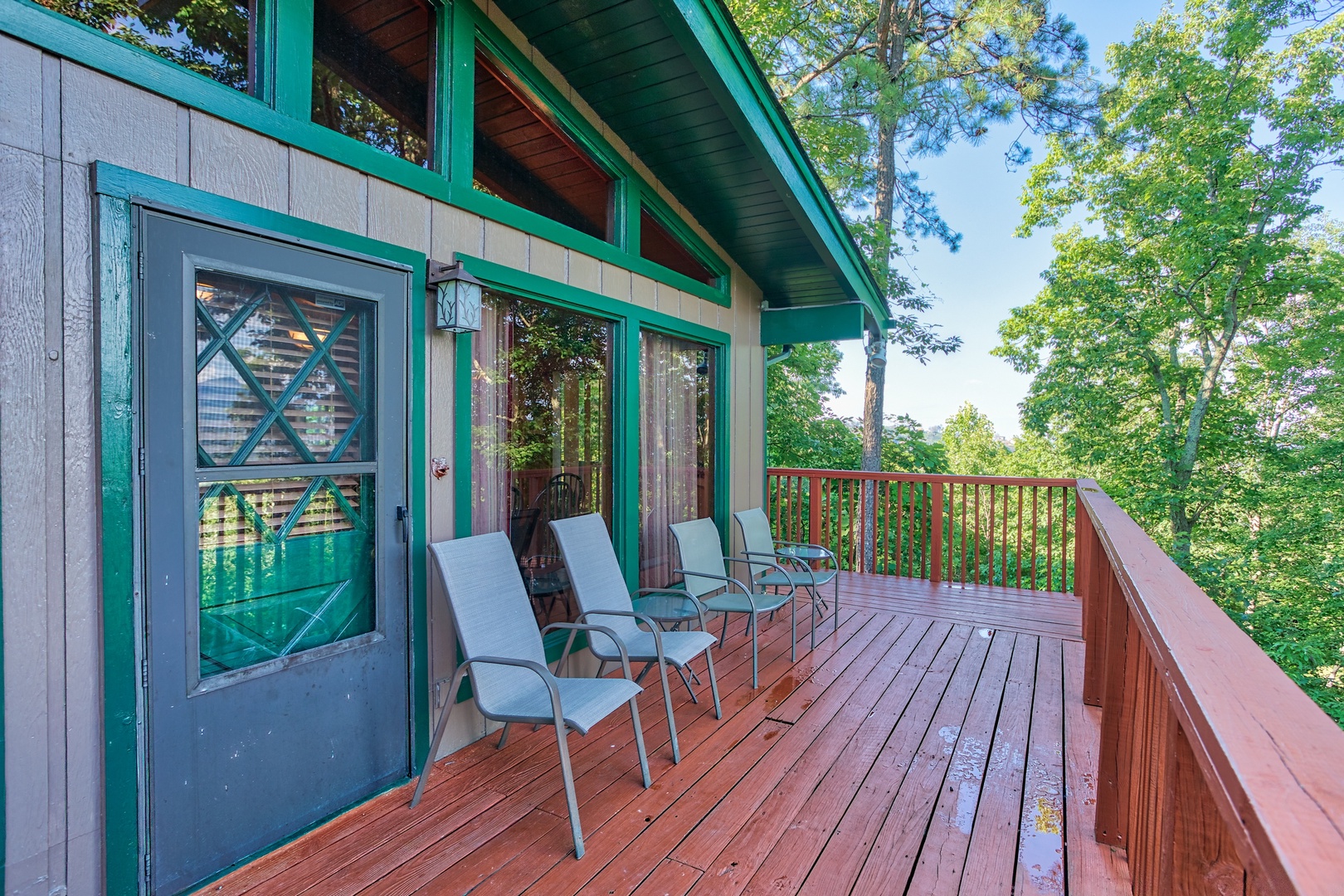 Main entrance and seating on the deck at Bushwood Lodge, a 3-bedroom cabin rental located in Gatlinburg