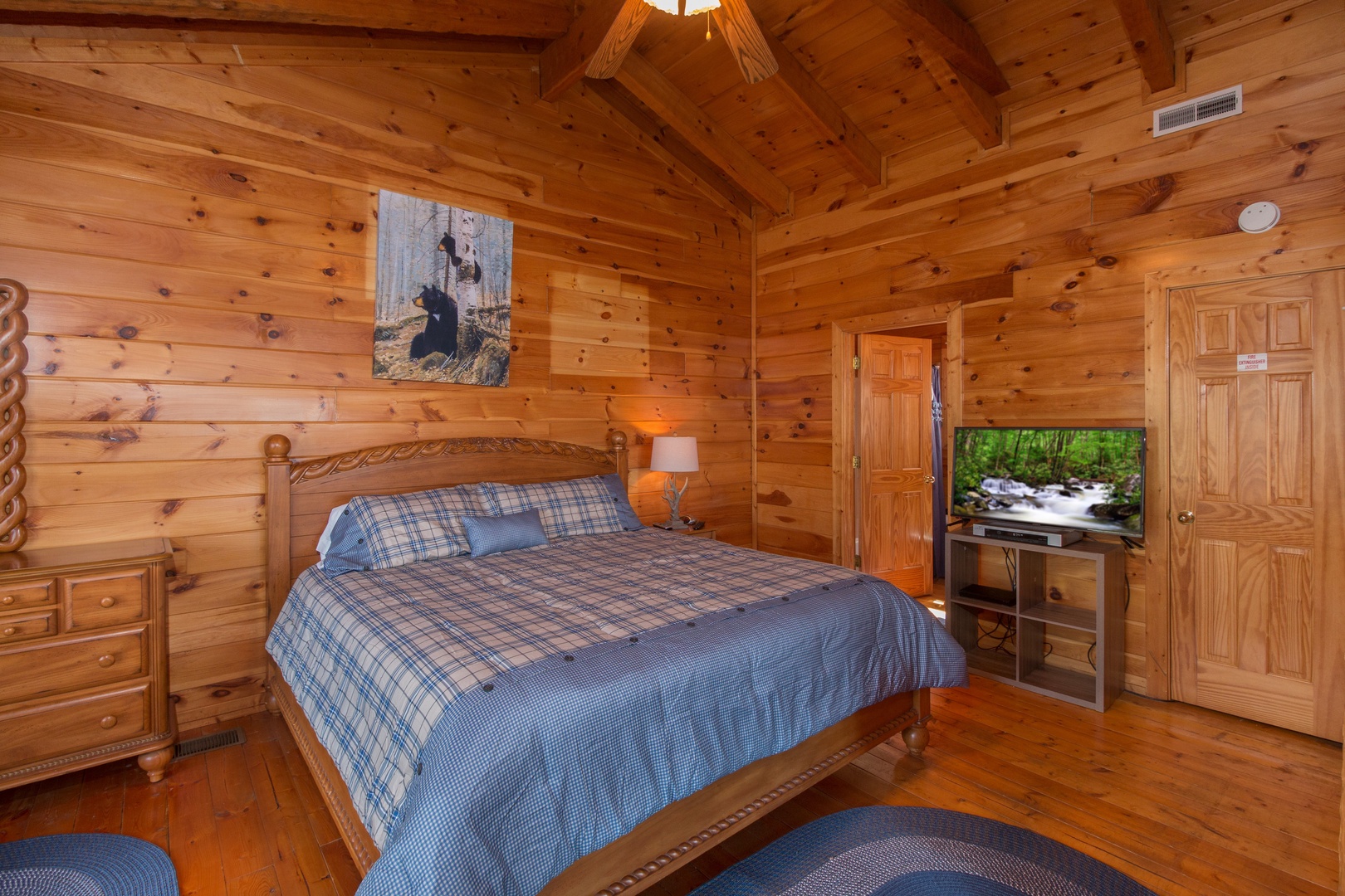 Bedroom with a king bed and TV at Ella-Vation, a 3 bedroom cabin rental located in Gatlinburg